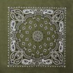 A green bandana features intricate white paisley patterns and floral motifs in a symmetrical design  resting flat on a neutral background.