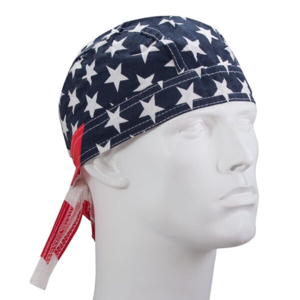 A fabric cap features a design of white stars on a navy background with red accents sitting on a white mannequin head against a plain backdrop.