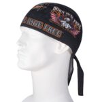 A black bandana sits on a white mannequin head facing sideways featuring the text "BORN TO BE FREE" and an eagle graphic with red feathers in a contextual display of biker culture.