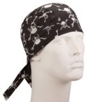 A black skull-patterned bandana is positioned on a mannequin head with a neutral expression showcasing its design of white skulls and crossbones against a black background. The bandana has ties at the back.