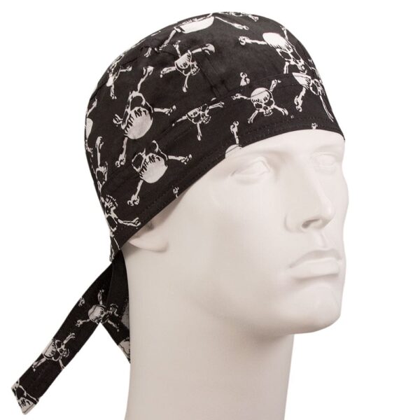 A black skull-patterned bandana is positioned on a mannequin head with a neutral expression showcasing its design of white skulls and crossbones against a black background. The bandana has ties at the back.