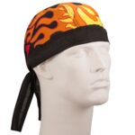 A brightly colored bandana with flame patterns is positioned on a white mannequin head while tied at the back showcasing its vibrant design against a neutral background.