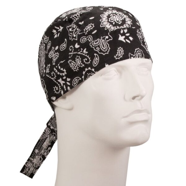 A black bandana with white paisley patterns is tied around a mannequin's head facing slightly to the side in a neutral setting highlighting the headwear's design and style.