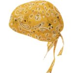 A yellow bandana hat with a paisley pattern is positioned at an angle showing ties at the back suggesting it is designed for headwear in casual or outdoor settings.
