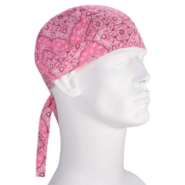 A pink bandana is tied around the head of a white mannequin figure the bandana features a paisley pattern with a long tail hanging down the side against a white background