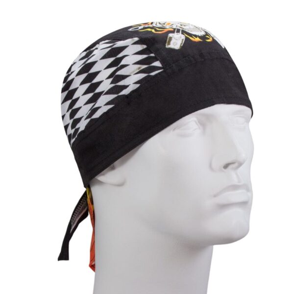 A black bandana is worn on a mannequin head featuring a diamond pattern on one side and colorful designs on the other showcasing a stylized graphic print and long ties at the back.