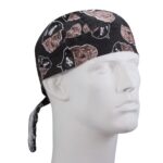 A black bandana featuring pirate skull patterns is displayed on a white mannequin head facing right in a neutral setting  emphasizing the design and theme of the fabric.