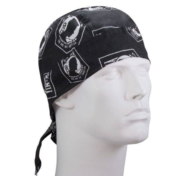 A black bandana with white printed designs rests on a mannequin's head  showcasing various symbols and phrases  suggesting a style associated with casual or outdoor wear.