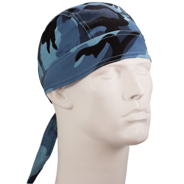 A blue and black camouflaged bandana is tied around the head of a white mannequin with a neutral expression showcasing the headwear's design in a plain background.