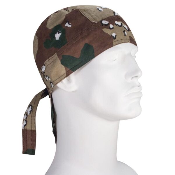 A camouflage bandana is draped around a mannequin's head with ties hanging down at the side demonstrating a practical accessory for outdoor or military settings.