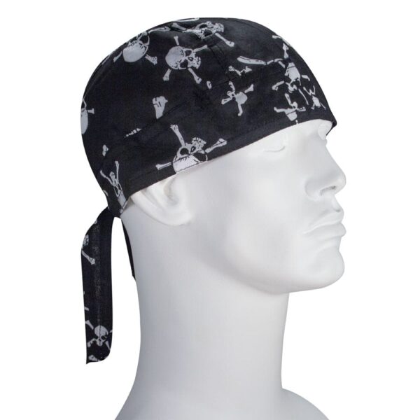 A black bandana is worn on a white mannequin head featuring white skull and crossbones designs the bandana is tied at the back with two hanging ends