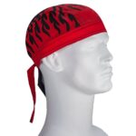 A red bandana with black flame patterns is tied around the head of a white mannequin facing sideways in a neutral setting  emphasizing the design and colors of the headwear.