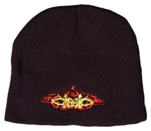 A black knit beanie features a colorful graphic design on the front representing stylized text and shapes showcasing vibrant red and yellow hues against the dark background.