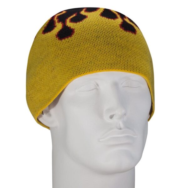 A yellow knit beanie is displayed on a mannequin head facing slightly to the side featuring a black and red flame design along the top edge set against a neutral background.