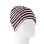 A striped beanie hat in pink and black rests on a plain mannequin head showcasing its smooth fabric and snug fit surrounded by a stark white background