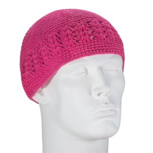 A pink crocheted beanie sits on a white mannequin head showcasing its textured pattern in a neutral setting emphasizing the design and color of the hat.