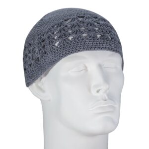 A gray crocheted hat is placed on a white mannequin head showcasing its open pattern and snug fit within a simplistic display setting highlighting the hat's texture and design.