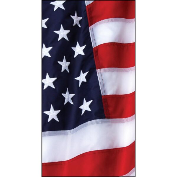 A flag with alternating red and white stripes and a blue field adorned with white stars gently flutters in the breeze against a neutral background.